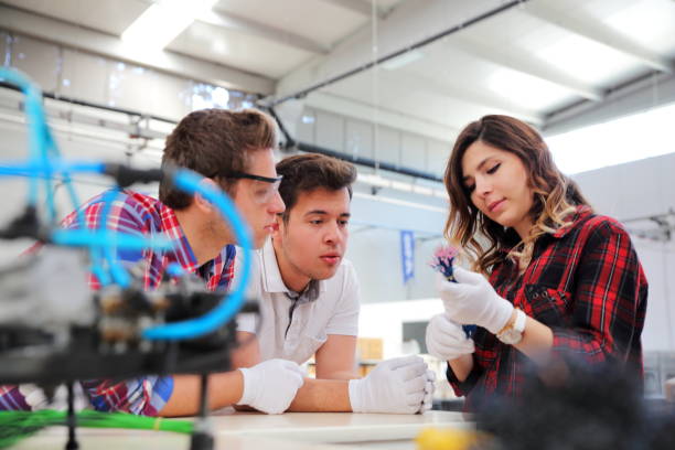 istock Mechanic And Female Engineer Talking in Factory 1009909378