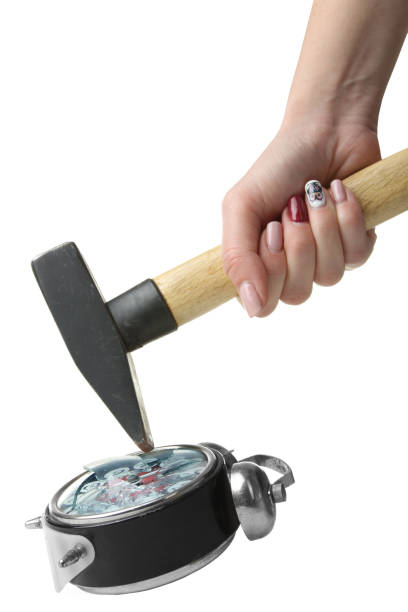 Broken alarm clock Broken alarm clock and hammer isolated on white background. smash alarm clock stock pictures, royalty-free photos & images