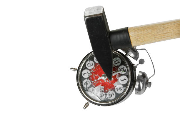 Broken alarm clock Broken alarm clock and hammer isolated on white background. smash alarm clock stock pictures, royalty-free photos & images