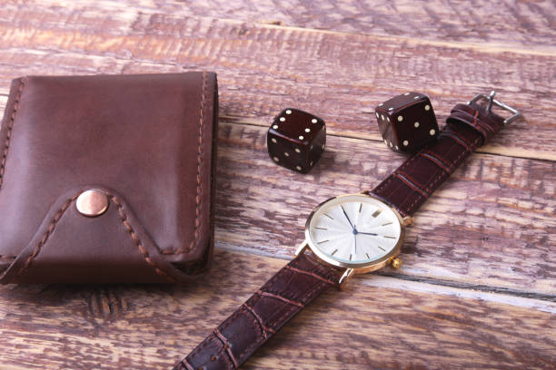 istock Men's accessories with brown leather wallet, belt and watch. 1009913432