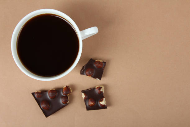 istock cup of coffee and pieces of chocolate with nuts 1009913434