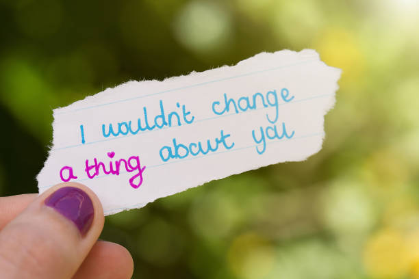 istock Hand-written love note held by woman 1009925324