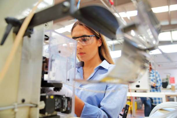 istock Woman working in a factory 1009926388