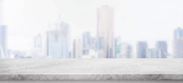 istock Empty white Stone table top and blur glass window wall building banner background with vintage filter - can used for display or montage your products. 1009929210