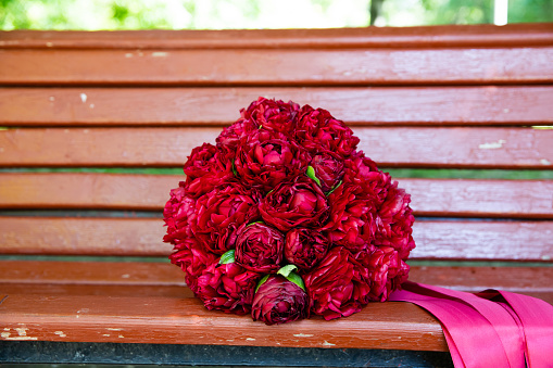Beautiful wedding bouquet of red peony
