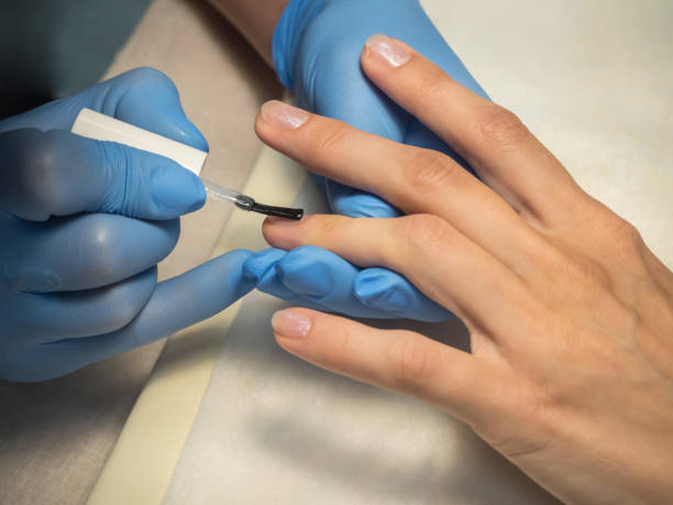 istock Manicure procedures. Nail uv-varnish, close-up. 1009933124