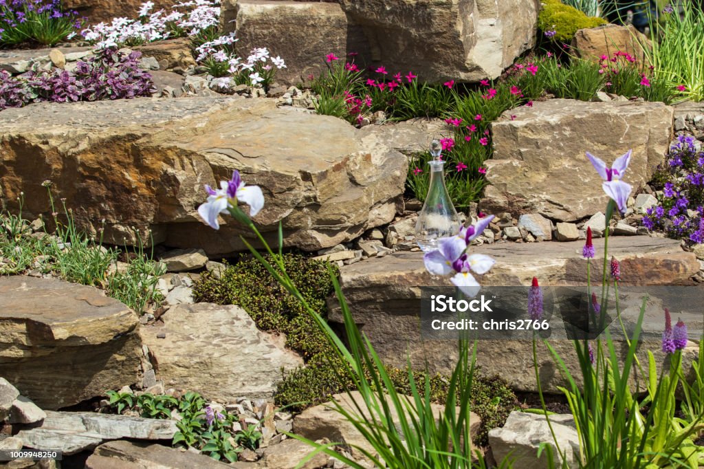 Rockery A beautiful garden rockery with alpines Rock Garden Stock Photo