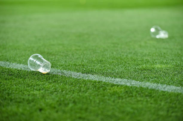 istock Plastic trash can on the turf on a soccer field 1009949202