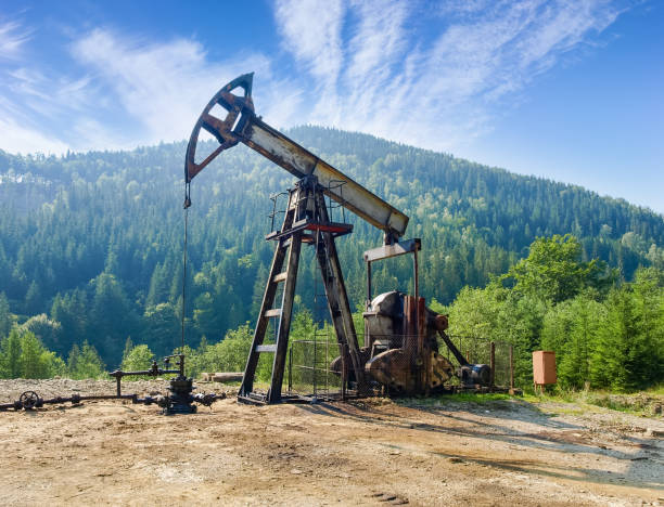 Oil well with pump-jack in the Carpathian Mountains
