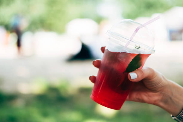istock Woman hand holding fresh sangria cocktail 1009955626