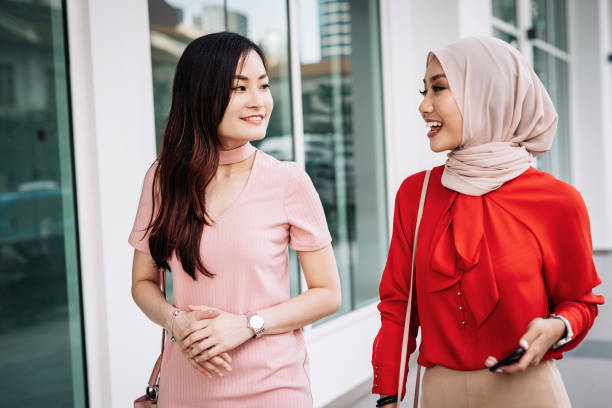 istock Two businesswomen after work having fun 1009966480