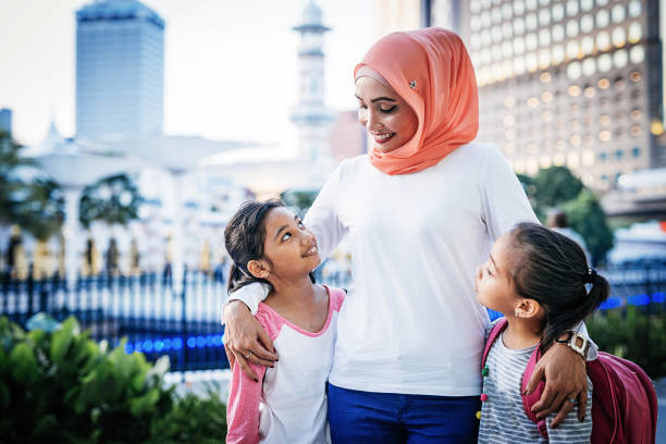 istock Mother with two school kids 1009970108