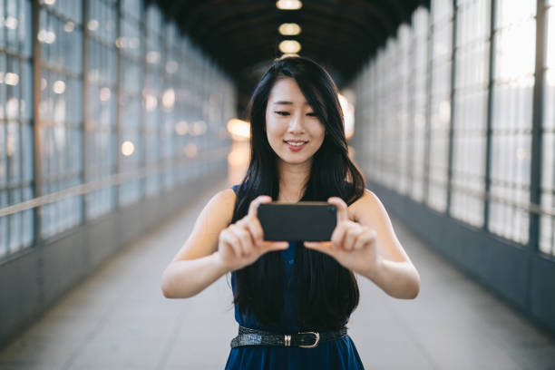istock Woman taking pictures with her smartphone. 1009972854