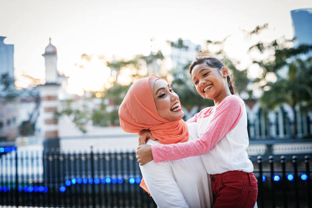 Back to school - mother preparing daughter for school and sharing love