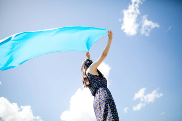 istock a young woman in the spring 1009973836