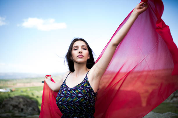 istock a young woman in the spring 1009976242