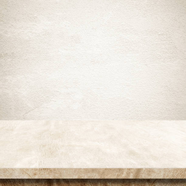 istock Empty brown cement table over brown wall background, banner, table top, shelf, counter design for product display montage 1009979790