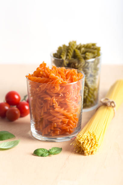 istock Different types of Italian pasta with vegetables on the table 1009984214
