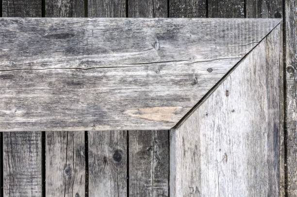 Aged gray nonpainted surface wooden bench and planks texture background stock photo