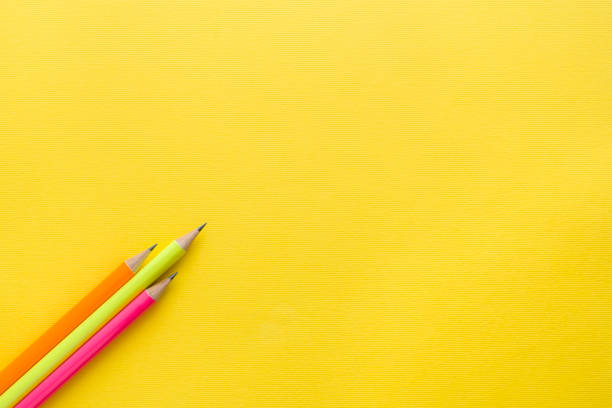 istock Bright colored pencils on yellow background. Copy space 1009993328