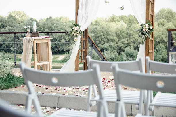 istock wedding arch on the river bank 1009993610