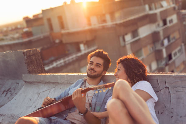 istock Couple at a rooftop party 1009997020