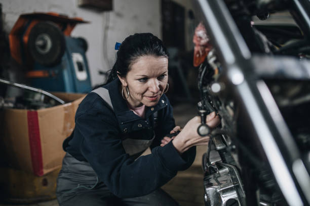 istock Man worker in motorcycle repair shop 1010001988