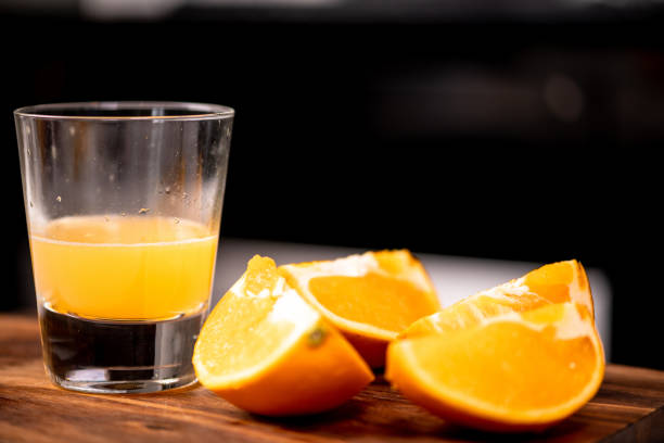 istock Freshly squeeze orange juice on wooden board. 1010007046