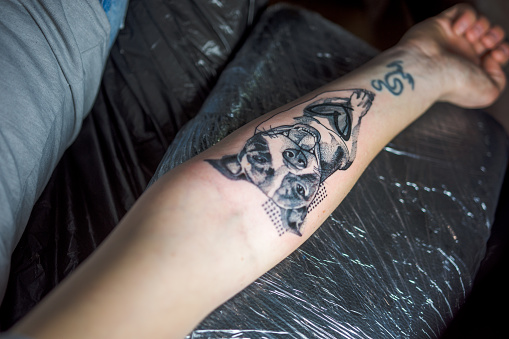 Black and white tattoo on an arm