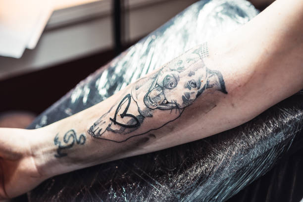 istock Black and white tattoo on an arm 1010014972