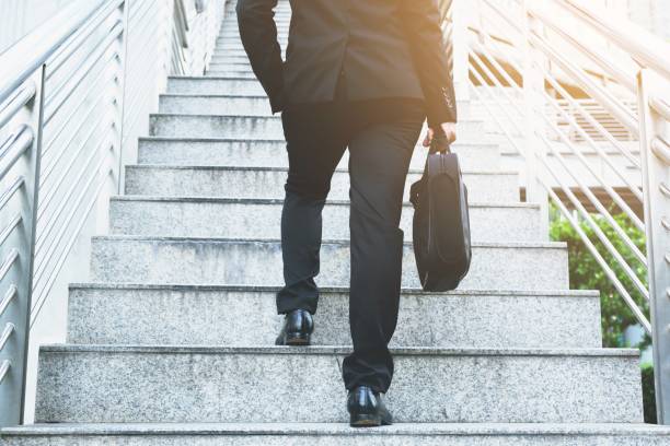 istock Businessman is walking up the stairs. 1010015726