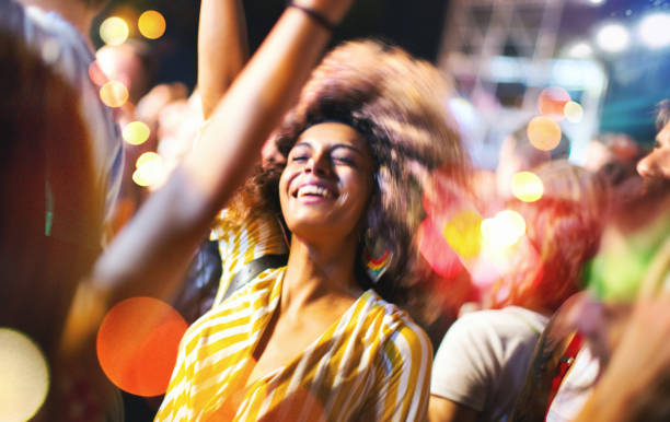 istock Friends dancing at a concert. 1010018604