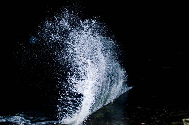 Splashing wave on the Black sea. Splashing wave on the Black sea in the night. breaking wave stock pictures, royalty-free photos & images
