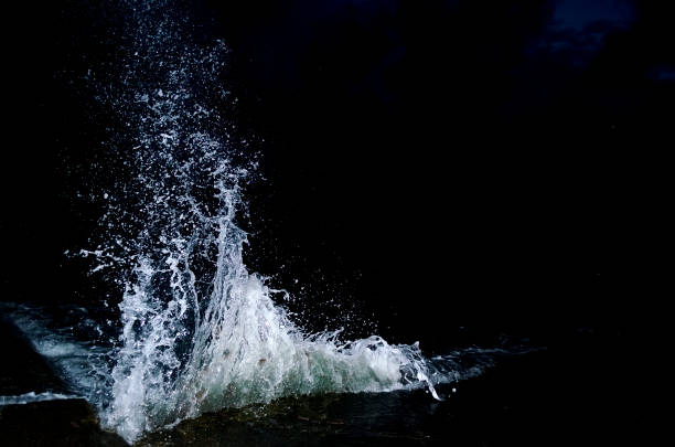 Splashing wave on the Black sea in the night.