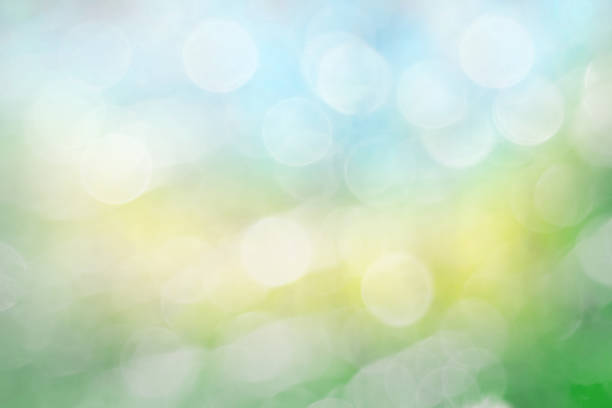 istock Bokeh Wallpaper and Grass Blue, yellow and green 1010022654