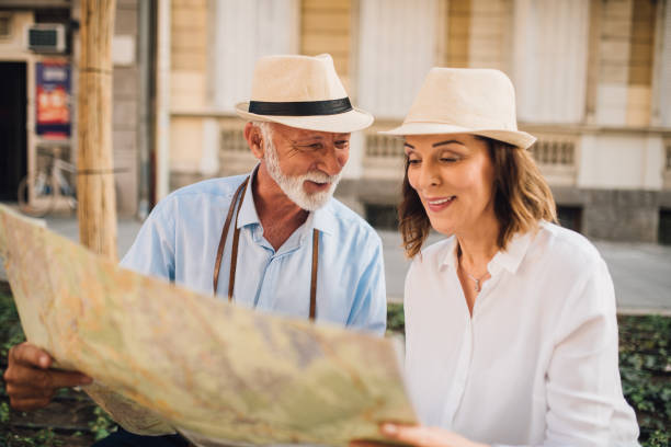 istock Elderly man looking at his wife reading the map 1010023156