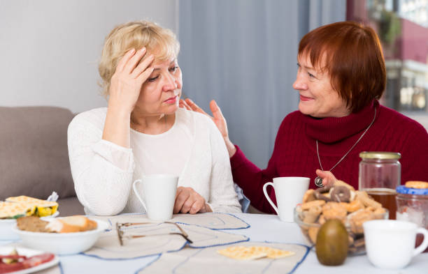 istock Mature lady comforting upset female 1010023222