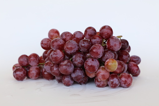 Bunch of grapes over white background