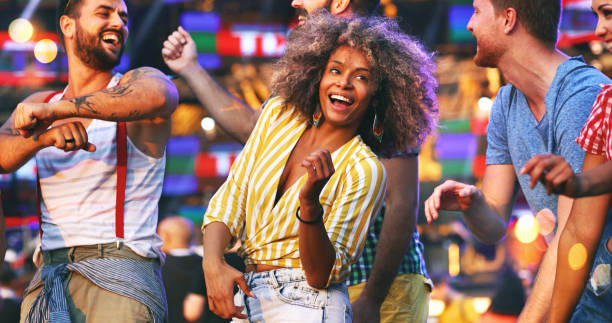 istock Friends dancing at a concert. 1010032710