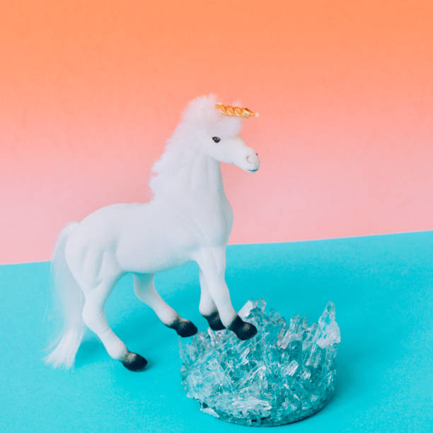 istock A white unicorn with a Golden horn and crystals. 1010035732