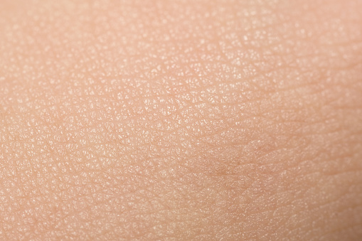Close-up extremo de piel bronceada por parte masculina photo