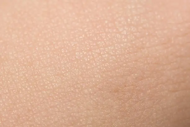 Photo of Extreme Close-Up Of Tanned Skin On Male Hand