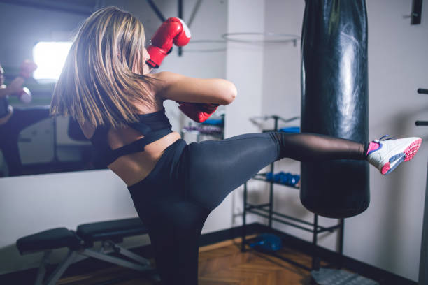 istock Woman practicing boxing in gym 1010039756