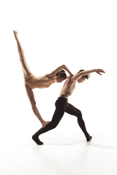 istock The two young modern ballet dancers posing over gray studio background 1010040418