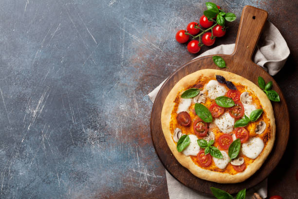 istock Italian pizza with tomatoes, mozzarella and basil 1010044936