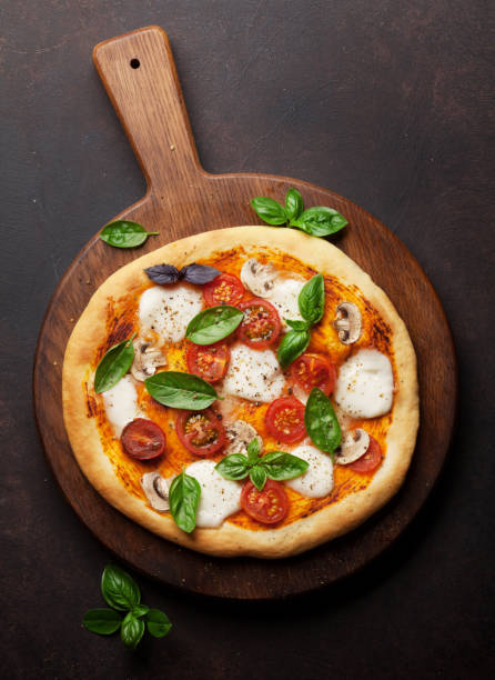 istock Italian pizza with tomatoes, mozzarella and basil 1010044992