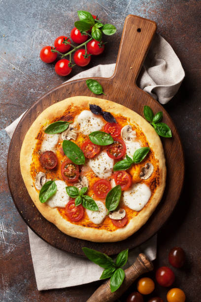 istock Italian pizza with tomatoes, mozzarella and basil 1010045054