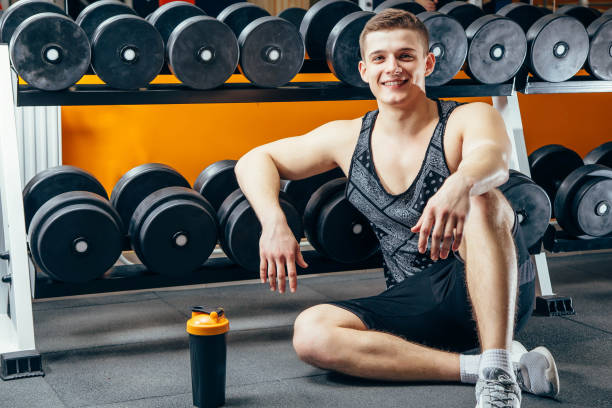 istock Happy attractive man resting after a workout at the gym. 1010051480