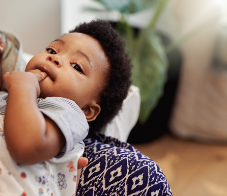 Cropped shot of a baby girl being held by her mother