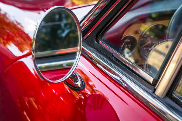 istock Side mirror of a vintage red car 1010058332